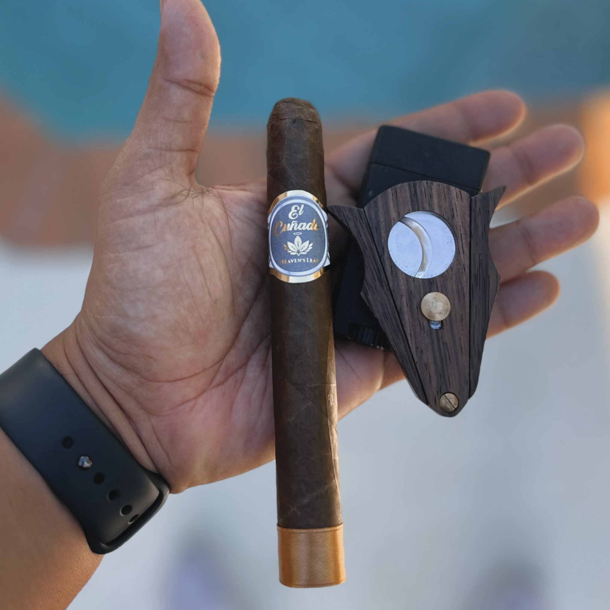 El Cuñado brand image — cigar and cutter in hand from Heaven's Leaf